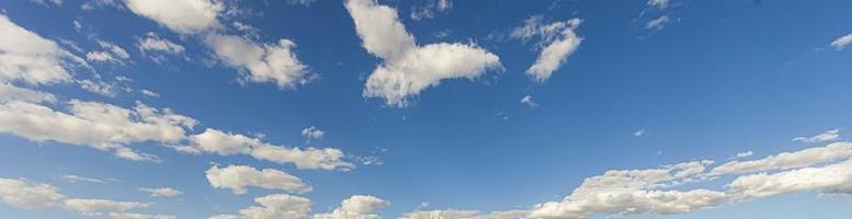 Image of a partly cloudy and partly clear sky during the day photo