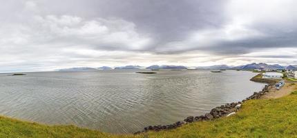 Panoramic picture of Vatnajoekull glacier tongues from Hoefn village photo