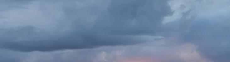 Dramatic colorful sky with afterglow and illuminated clouds photo