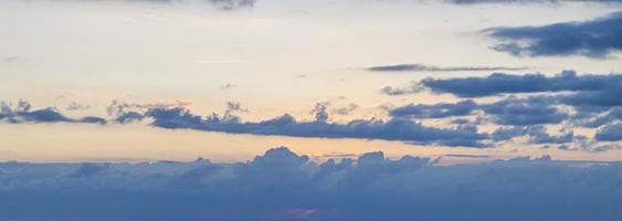 Dramatic colorful sky with afterglow and illuminated clouds photo