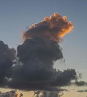 Dramatic colorful sky with afterglow and illuminated clouds photo