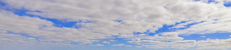 Image of a partly cloudy and partly clear sky during the day photo