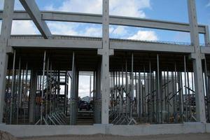 Construction site with precast concrete columns, beams and walls photo