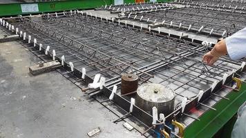 Precast concrete girder slab on a pallet with reinforcement and installation parts i ready for production photo