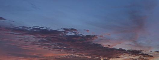 Dramatic colorful sky with afterglow and illuminated clouds photo