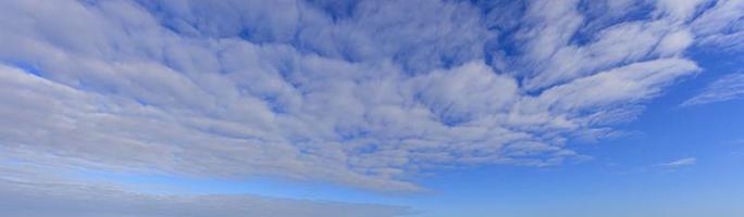 Image of a partly cloudy and partly clear sky during the day photo