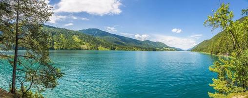 Panoramic view over lake Weissensee in Austria in summer during daytime photo