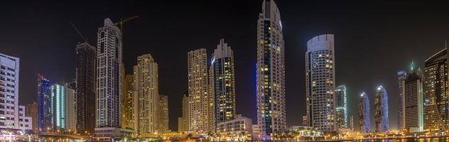 View of the skyscrapers of Dubai Marina district at night photo