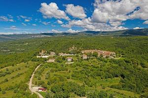 Panoramic aerial drone picture of Hum in Croatia, the smallest city in the world, during daytime photo