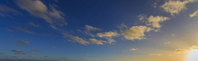 Dramatic colorful sky with afterglow and illuminated clouds photo