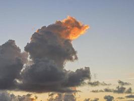 Dramatic colorful sky with afterglow and illuminated clouds photo