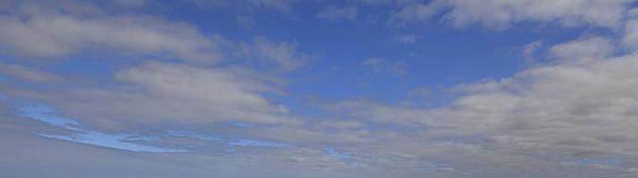 Image of a partly cloudy and partly clear sky during the day photo