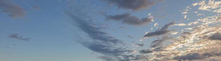 Dramatic colorful sky with afterglow and illuminated clouds photo