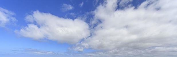 Image of a partly cloudy and partly clear sky during the day photo