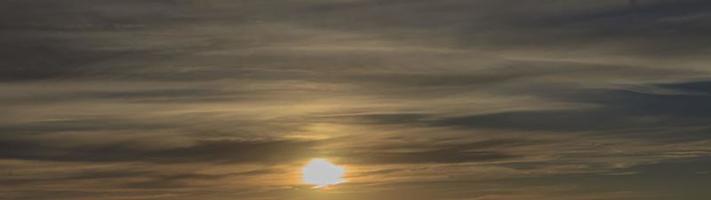 Dramatic colorful sky with afterglow and illuminated clouds photo