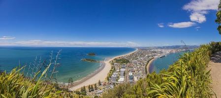 Panoramic picture of Tauranga city with Papamoa Beach from Mount Mainganui on northern island of New Zealand in summer photo