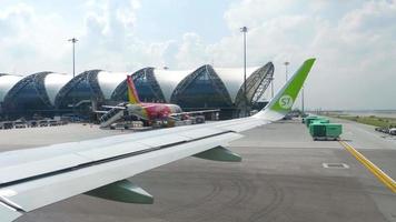 BANGKOK, THAILAND NOVEMBER 14, 2018 - Airplanes on apron of Subvarnabhumi airport, view fom taxiing aircraft video