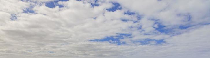 Image of a partly cloudy and partly clear sky during the day photo