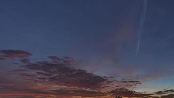 Dramatic colorful sky with afterglow and illuminated clouds photo