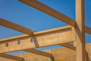 Construction site with precast concrete columns, beams and walls photo