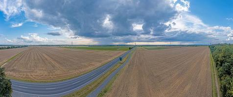 Drone panorama of a thunderstorm with rain and dramatic cloud formations over Leeheim in the Hessian Ried region photo