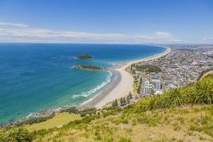 View on Touranga city and Papamoa Beach from Mount Maunganui on northern island of New Zealand in summer photo