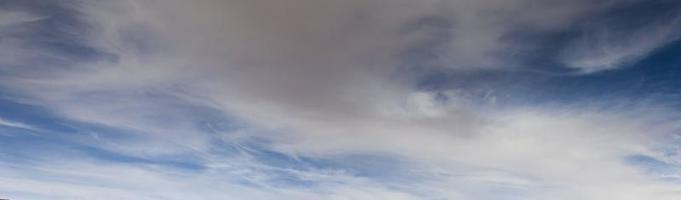 Image of a partly cloudy and partly clear sky during the day photo