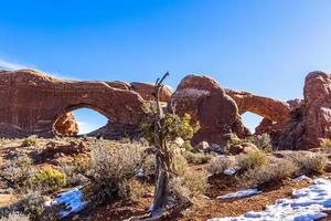 View on North and South Window arch in the Arches National Park in winter photo