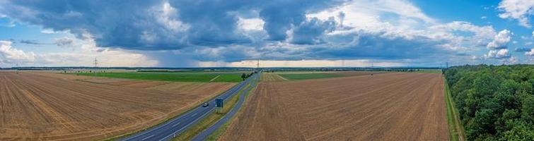 Drone panorama of a thunderstorm with rain and dramatic cloud formations over Leeheim in the Hessian Ried region photo