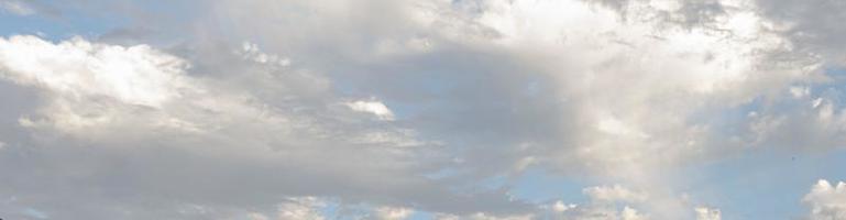 Image of a partly cloudy and partly clear sky during the day photo