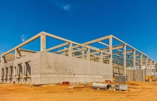 Construction site with precast concrete columns, beams and walls photo