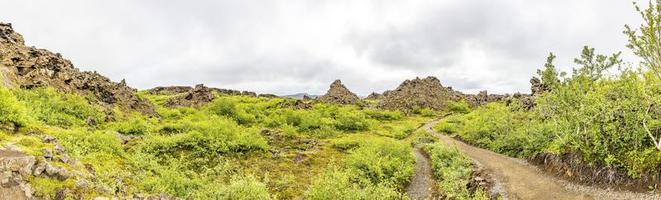 Picture of walks trough the great lava field in the south of Hverfjall volcano during daytime photo