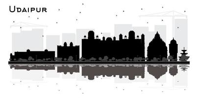 silueta del horizonte de la ciudad de udaipur india con edificios negros y reflejos aislados en blanco. vector