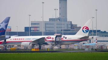 AMSTERDAM, THE NETHERLANDS JULY 26, 2017 - Boeing 777 China Cargo B 2077 unloading near Cargo terminal of Schiphol Airport, Amsterdam, Holland video