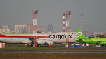 NOVOSIBIRSK, RUSSIAN FEDERATION JUNE 10, 2020 - Boeing 747 Cargolux in the terminal area of Tolmachevo airport, Novosibirsk. Cargo airplane. Boeing 747 cargo video