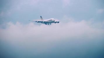 CHANGI, SINGAPORE NOVEMBER 25, 2018  - Singapore Airlines Airbus A380 with condensation plume approaching over the bay before landing in Changi Airport, Singapore video