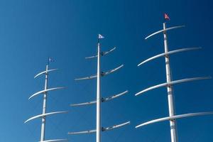 several masts of a yacht without sails photo