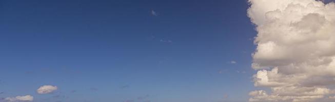 Image of a partly cloudy and partly clear sky during the day photo