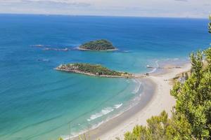 View on Touranga city and Papamoa Beach from Mount Maunganui on northern island of New Zealand in summer photo