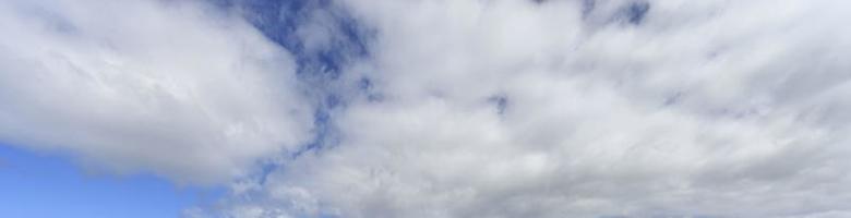 Image of a partly cloudy and partly clear sky during the day photo