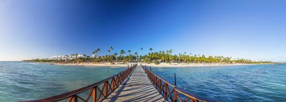 Panoramic picture over boat landing stage on a caribbean beach during daytime photo