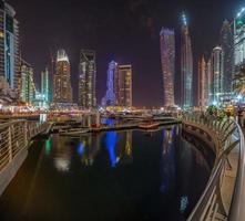 View of the skyscrapers of Dubai Marina district at night photo