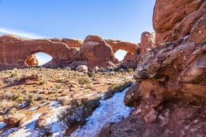 View on North and South Window arch in the Arches National Park in winter photo