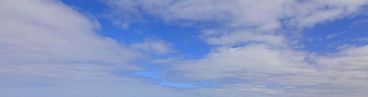 Image of a partly cloudy and partly clear sky during the day photo