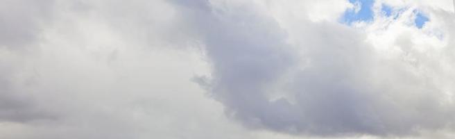 Image of a partly cloudy and partly clear sky during the day photo