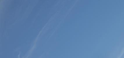 Image of a partly cloudy and partly clear sky during the day photo