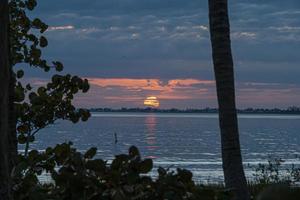 Sunset over sea with deserted beach in Florida photo