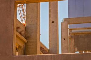 Construction site with precast concrete columns, beams and walls photo