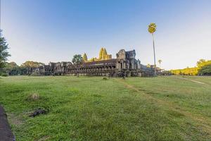 Mystical and famous ruins of Anchor Wat in Cambodia with no people in summer photo