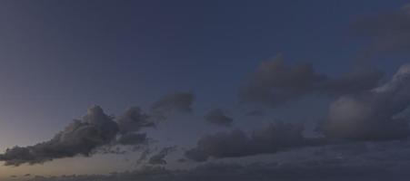 Dramatic colorful sky with afterglow and illuminated clouds photo